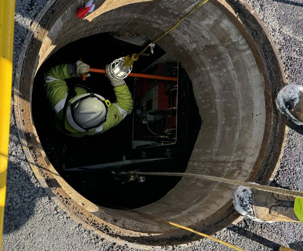 Worker in a Manhole